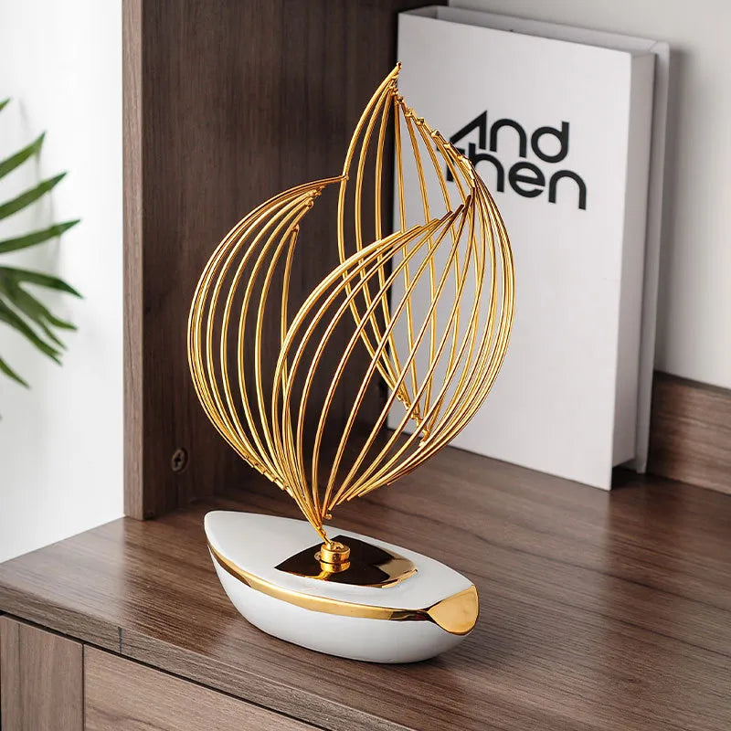 escultura-decorativa-barco-a-vela-branco-gold-modernize-foto-barco-sobre-estante-em-ambiente-claro-moderno