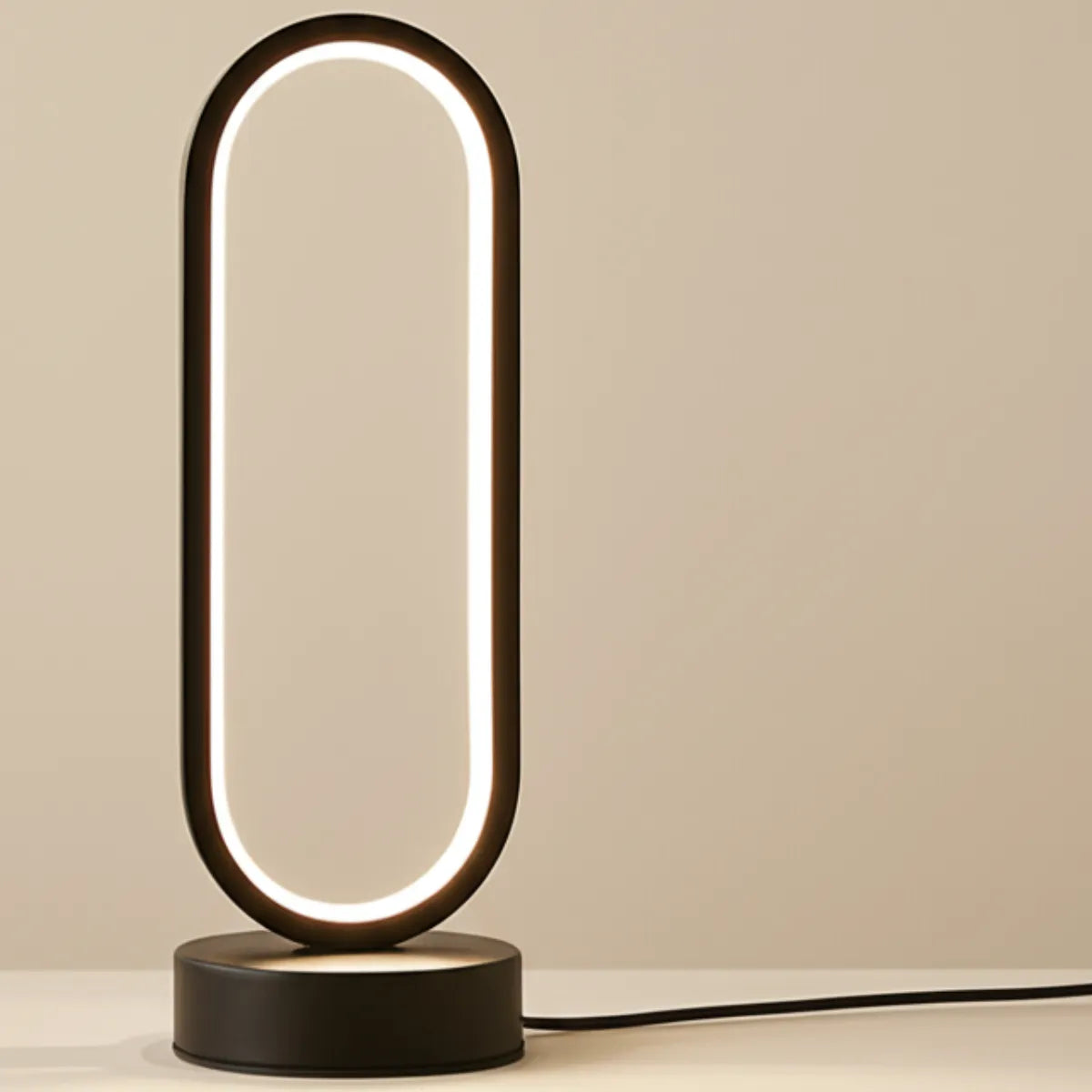 luminaria-abajur-de-mesa-led-elipse-modernize-foto-luminaria-em-fundo-neutro